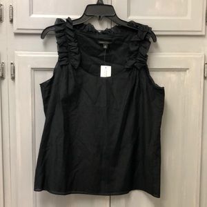 Sleeve less ruffed blouse.